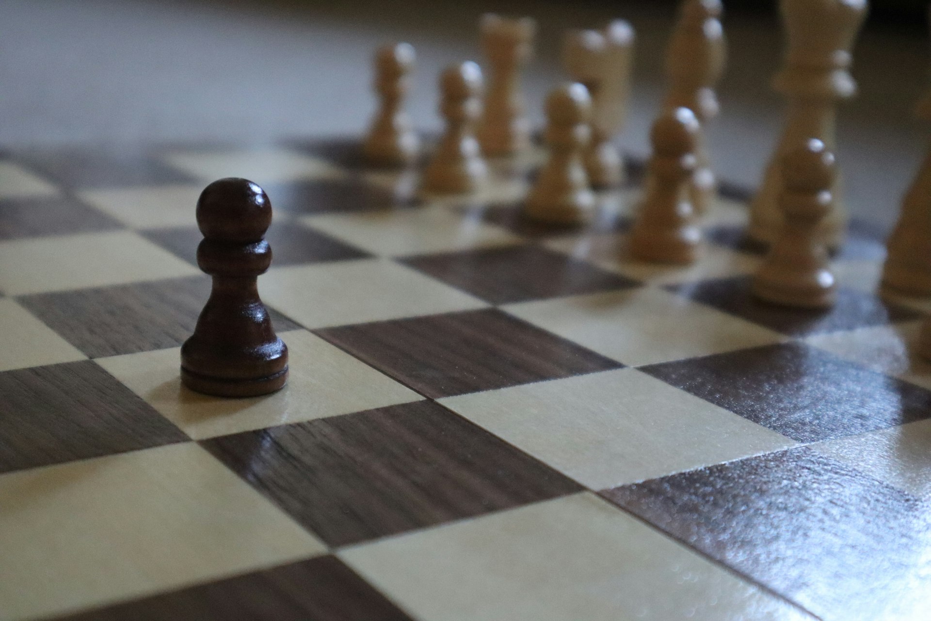 a close up of a chess board with pieces on it